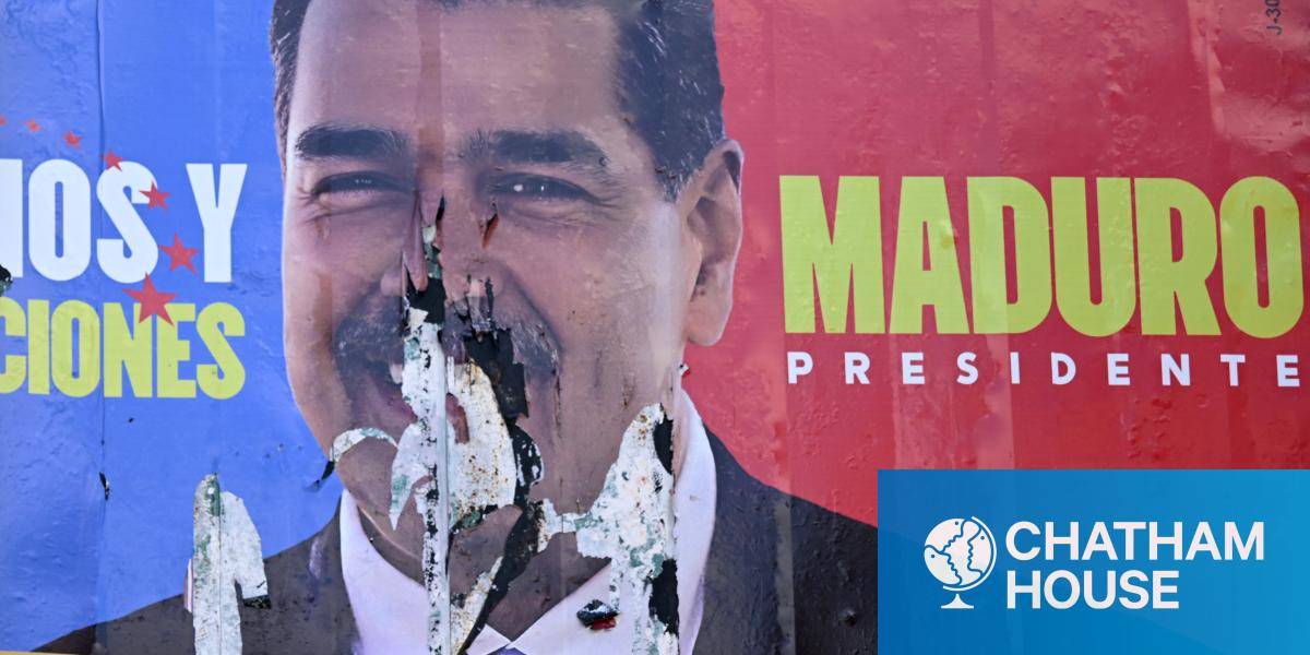 A burned election billboard of Venezuelan President Nicolas Maduro.